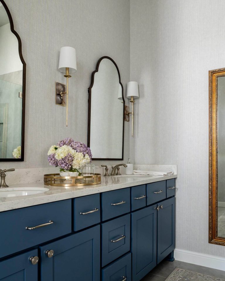 Blue Vanity with Arched Mirrors