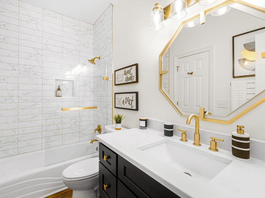 Bright Guest Bathroom with Gold Accents