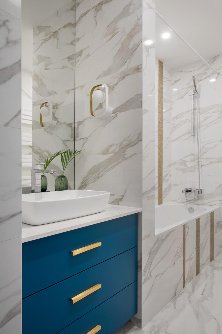 Contemporary Blue Vanity with Marble Wall