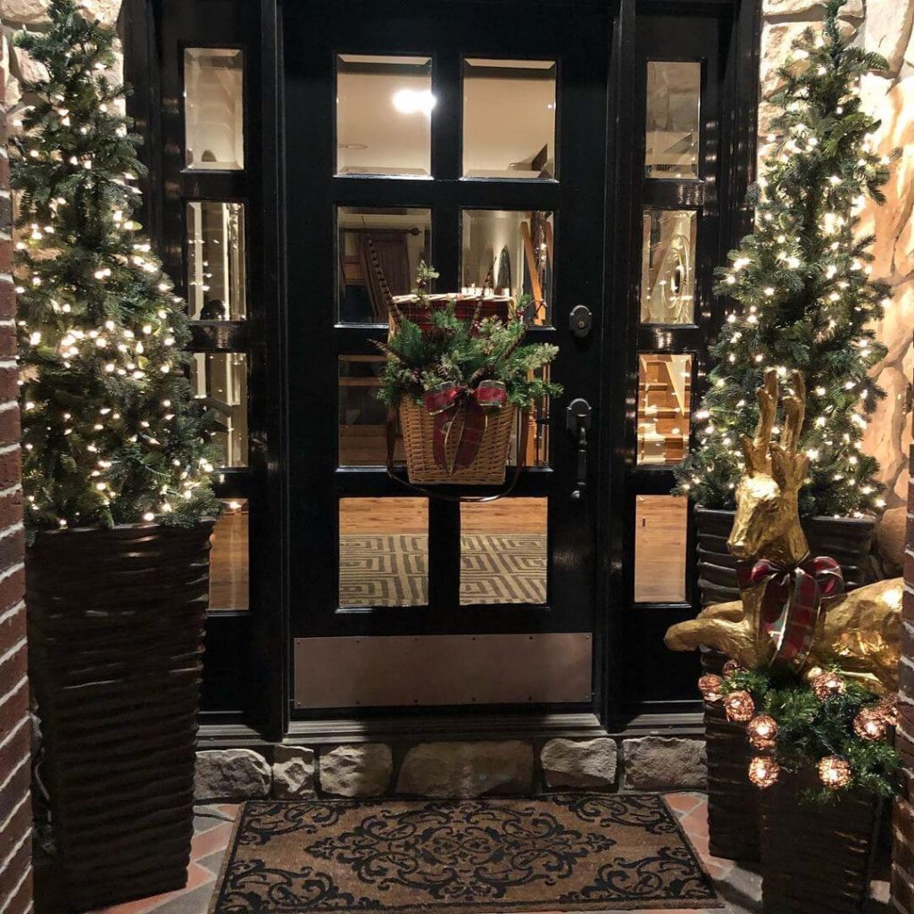 Cozy Rustic Entrance with Basket and Lit Trees