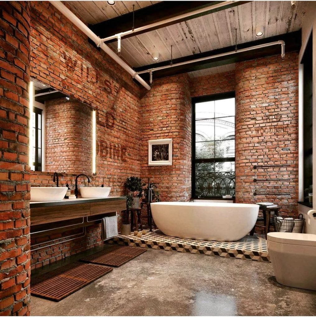 Exposed Brick Industrial Bathroom with Freestanding Tub