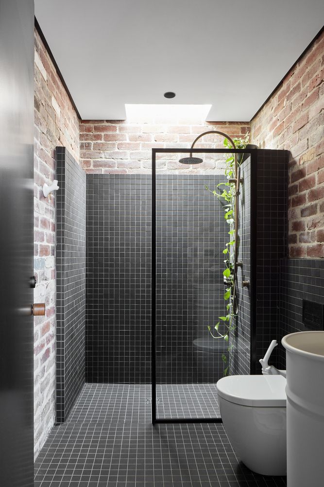 Exposed Brick and Black Tile Industrial Shower