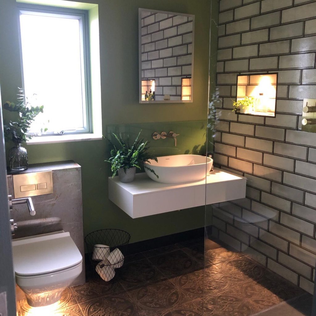 Green and Concrete Industrial Bathroom