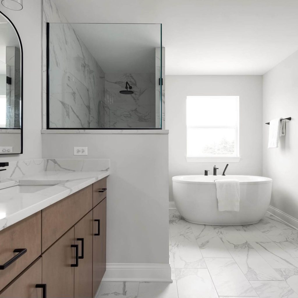 Minimalist Bathroom with White Wainscoting and Marble Finishes