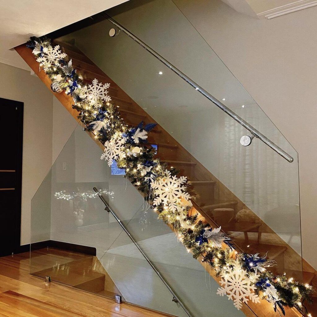 Modern Snowflake Garland on Glass Staircase