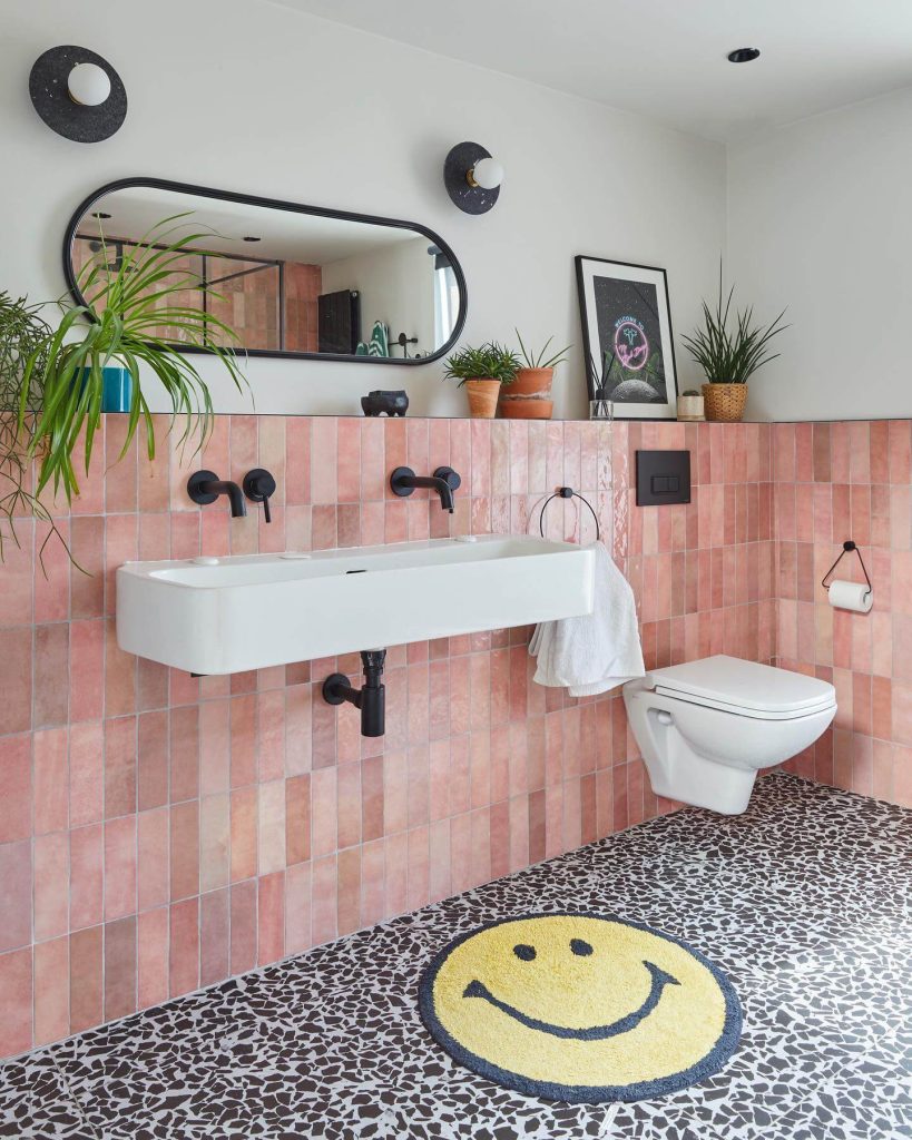 Playful Pink and Black Bathroom with Smile Rug