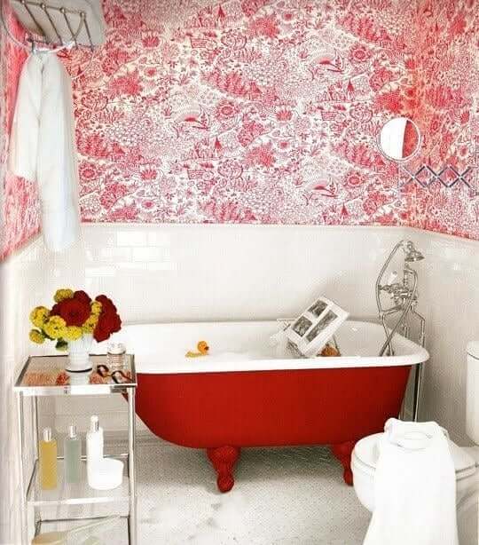 Red Clawfoot Tub and Floral Accents Bathroom