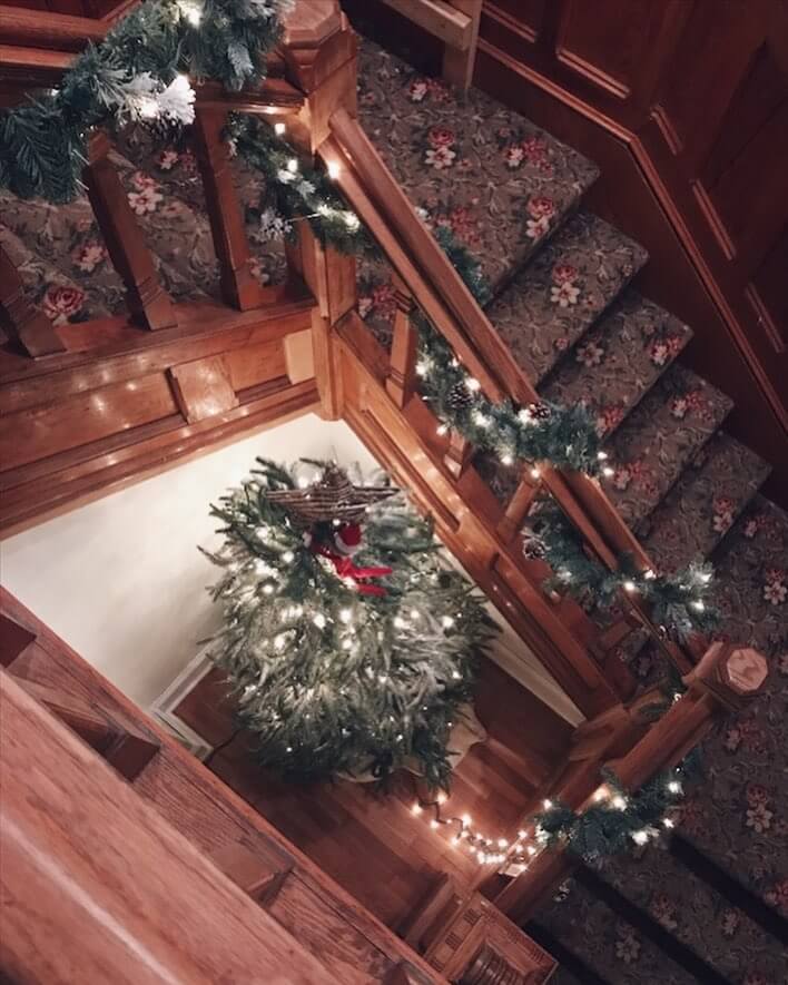 Rustic Staircase Decor with Garland and Tree