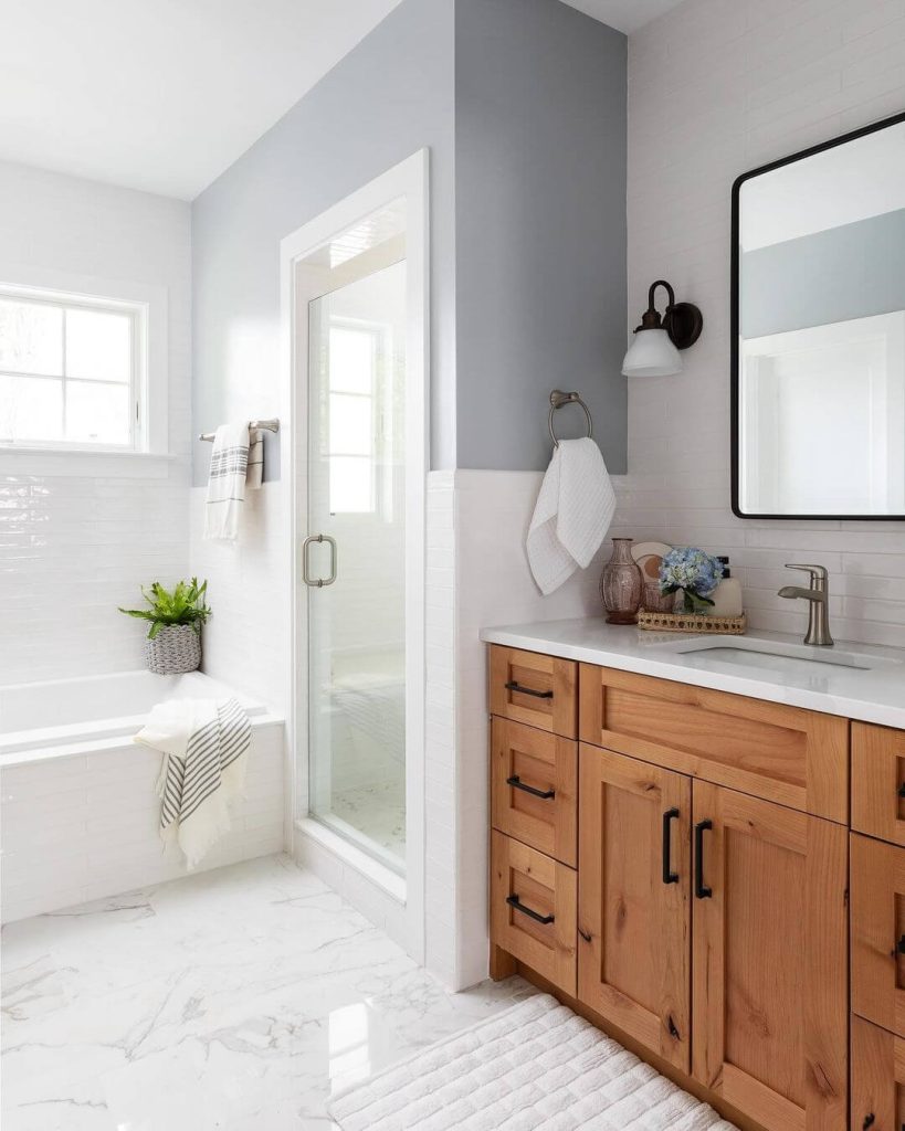 Rustic White and Wood Wainscoting in a Cozy Bathroom