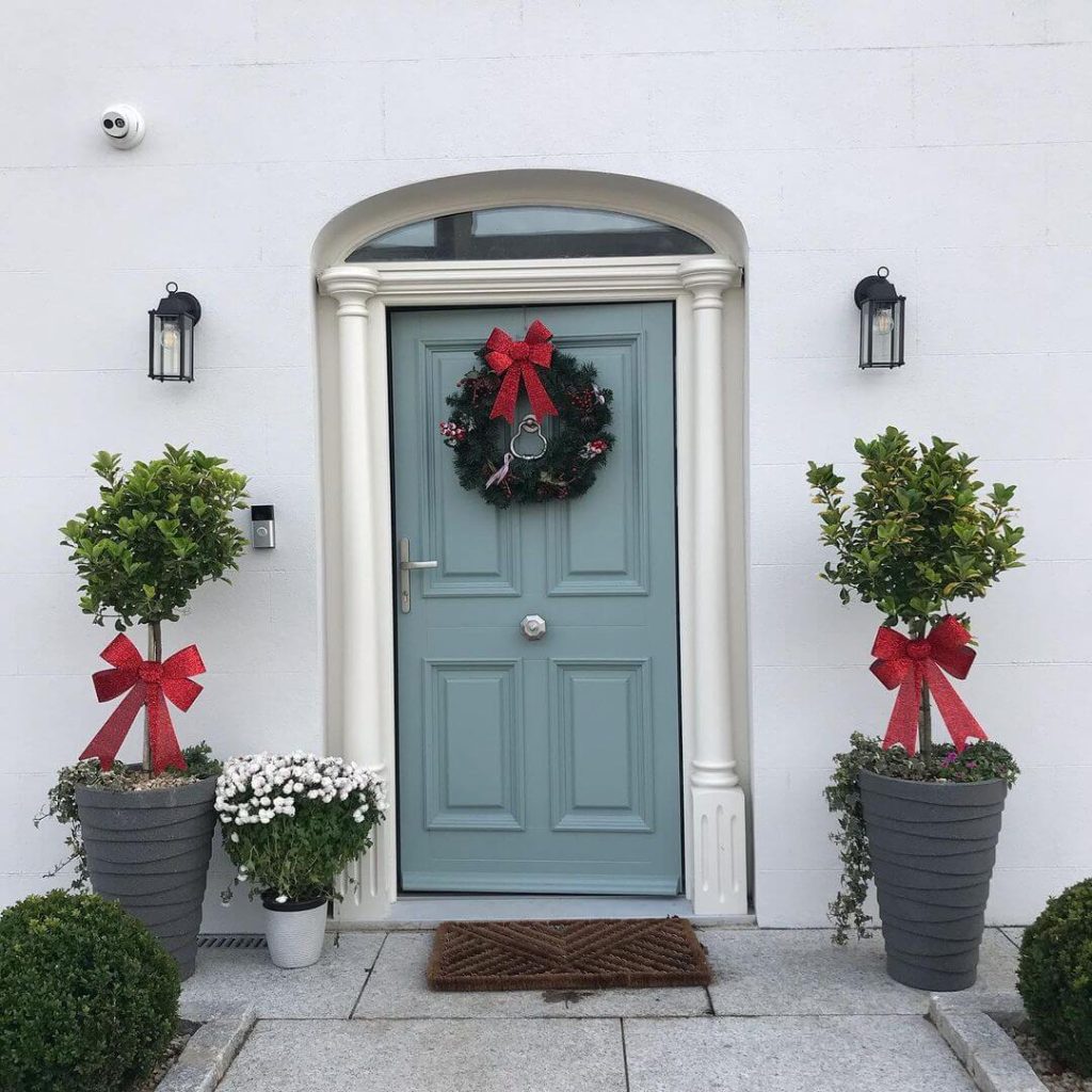 Simple Elegance with Red Bows and Greenery