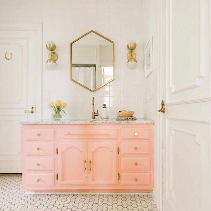 Soft Pastel Bathroom Counter with Gold Accents