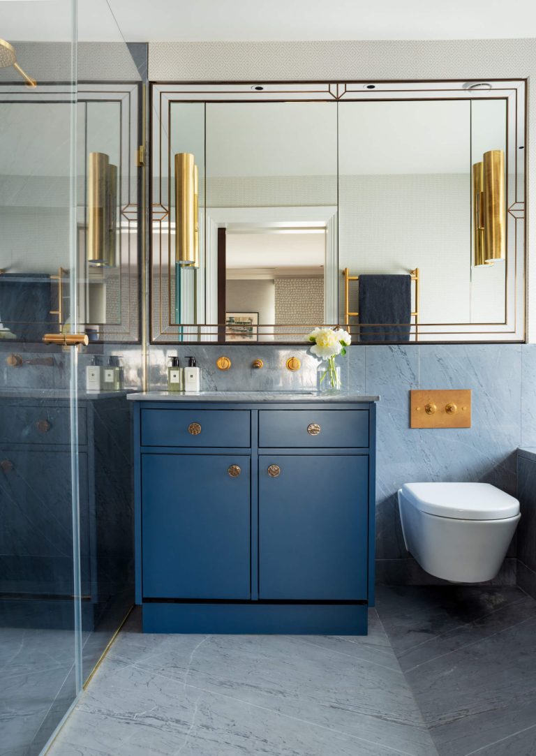 Transitional Blue Vanity in a Marble Bathroom