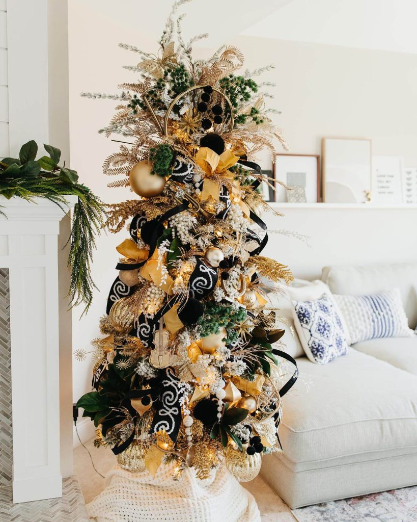 Whimsical Black and Gold Christmas Tree with Musical Accents