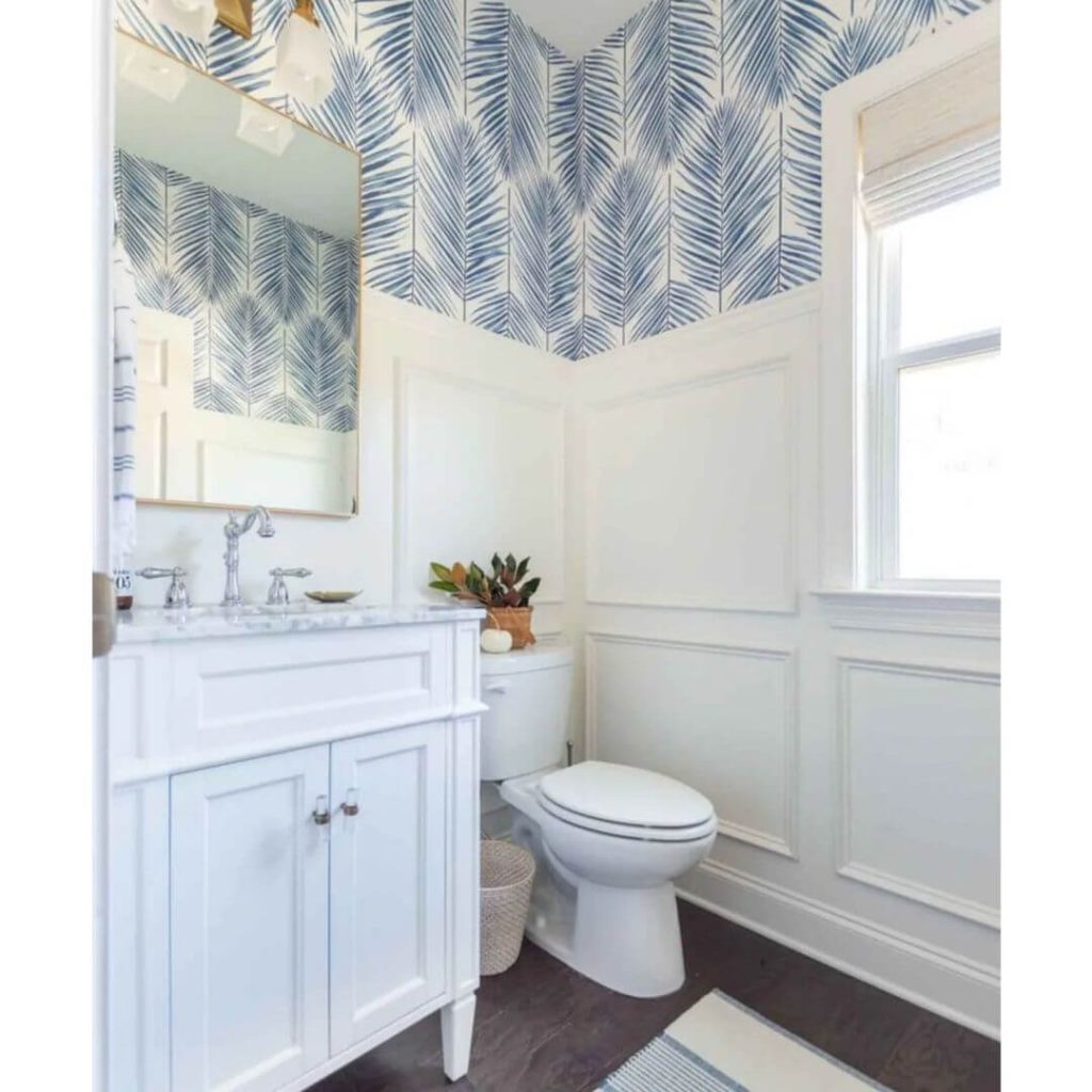 White Wainscoting Paired with Bold Leaf Wallpaper