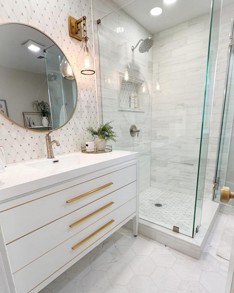 Bright Master Bathroom with White Vanity and Gold Hardware