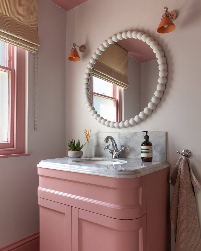 Elegant Pink Vanity with Marble Countertop