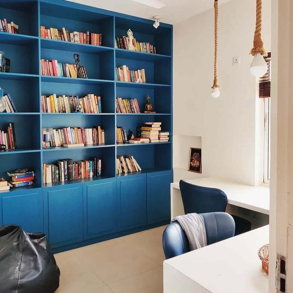 6. Modern Minimalism: Bold Blue Bookshelves