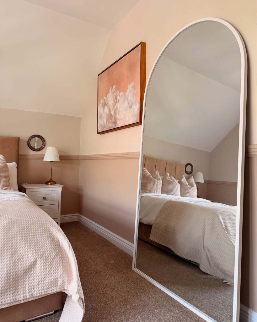 1. Create Calm with a Soft-Toned Arch Mirror