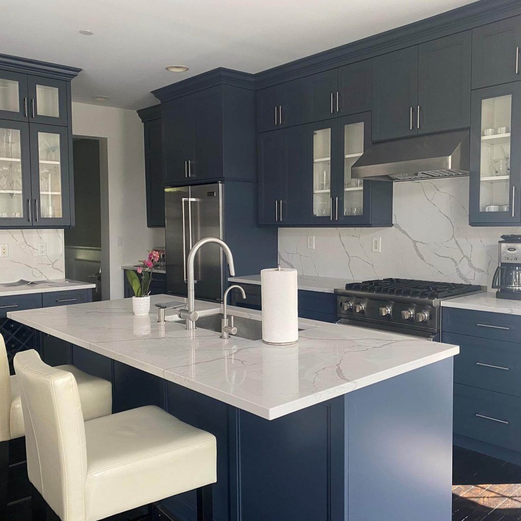 11. Marble Elegance in a Navy Dream Kitchen
