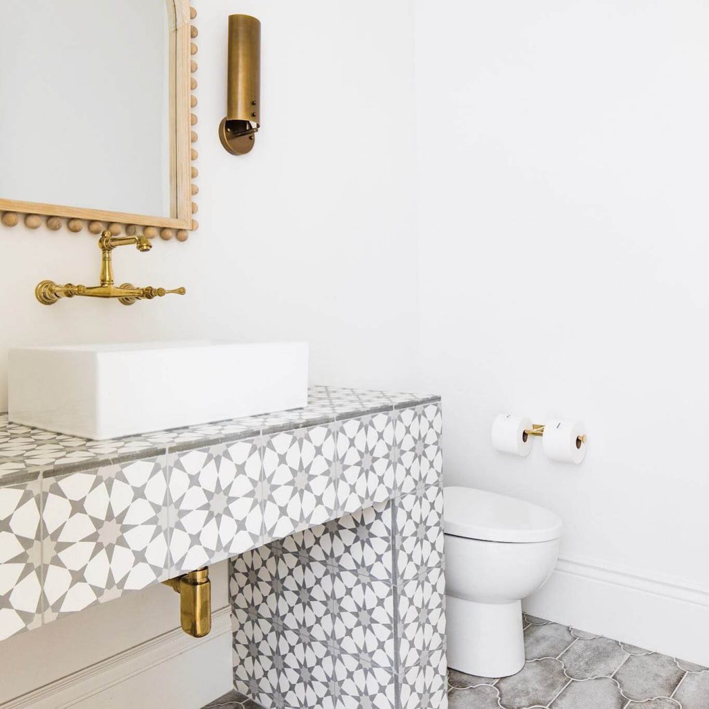 12. Patterned Tile and Brass Details for Euro-Inspired Flair