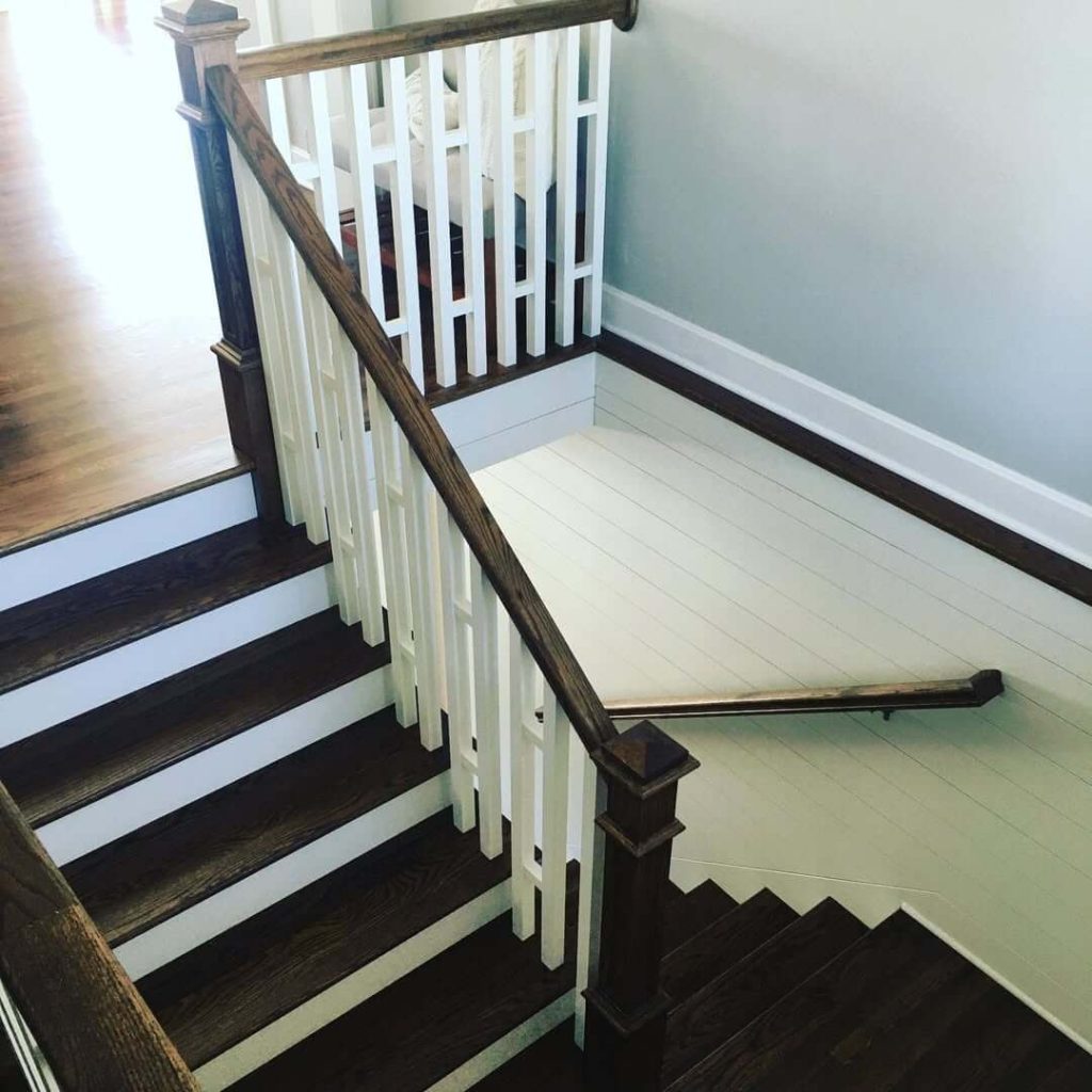15. Bold Contrast with Dark Wood and White Shiplap