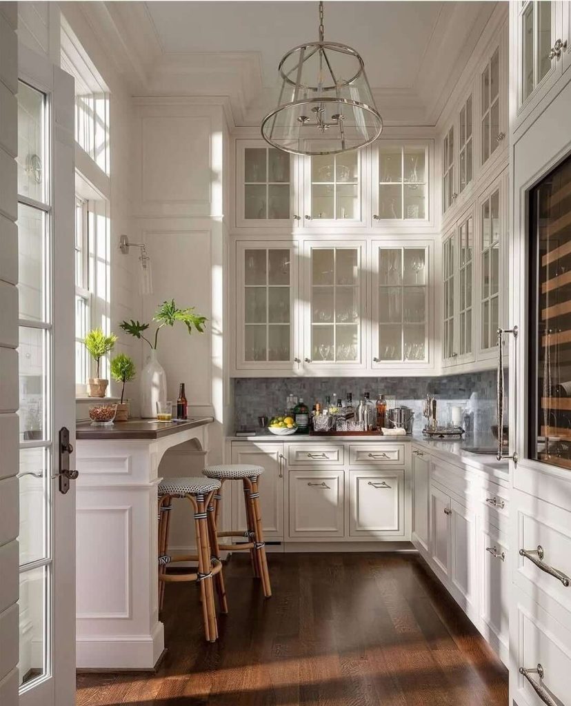 16. All-White Elegance with Glass-Front Cabinets