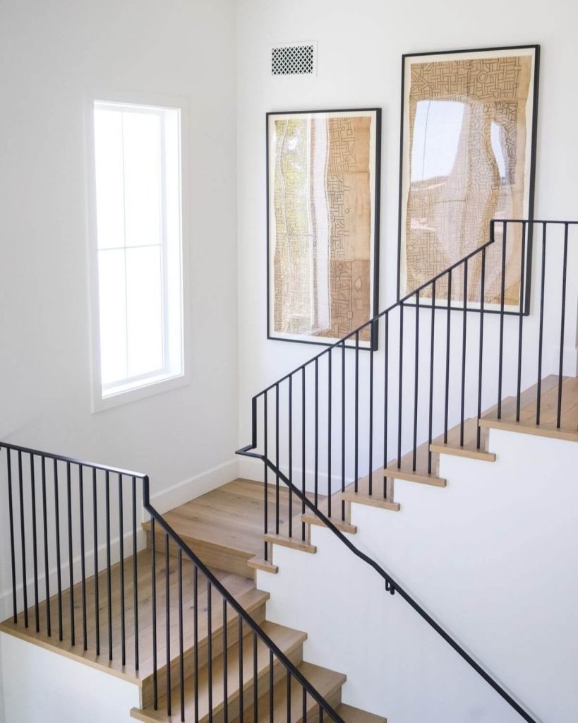 18. Embrace Clean Lines with Modern Railings and Abstract Art