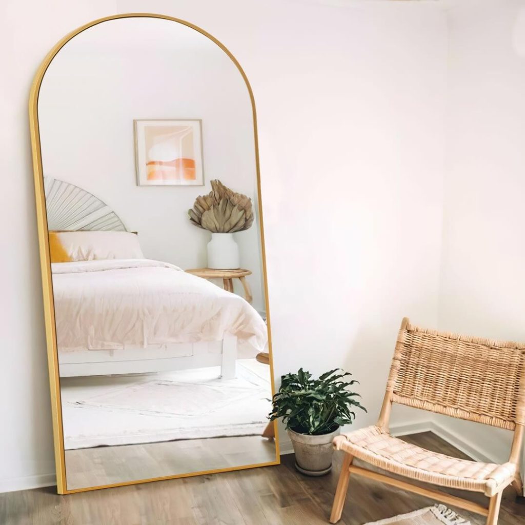 20. Go Modern Boho with a Golden Arch and Soft Neutrals