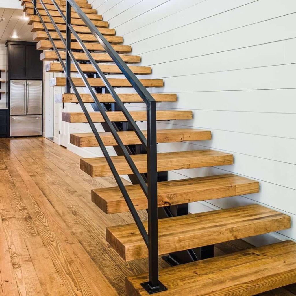 24. Industrial Loft Aesthetic with Floating Wood Treads
