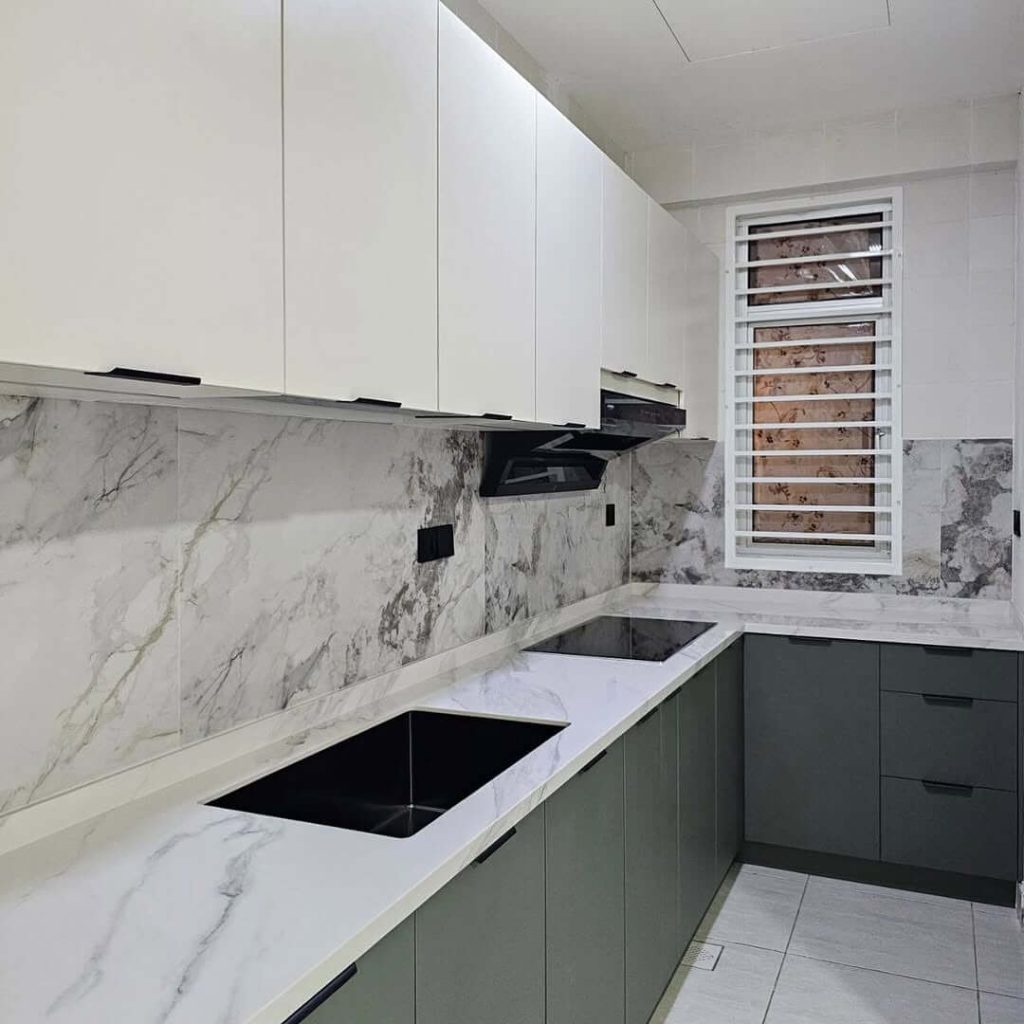27. Charcoal and White Cabinets with a Dramatic Marble Backsplash