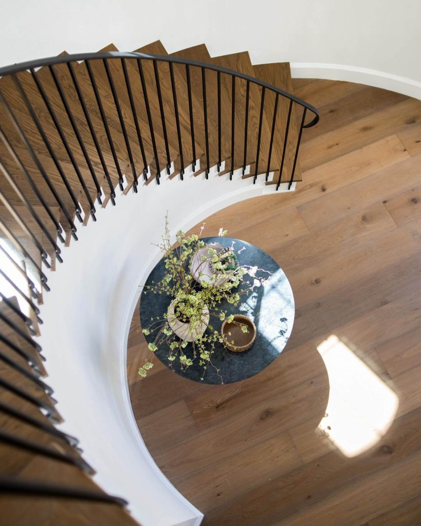 3. Dramatic Black Marble in a Curved Stairwell