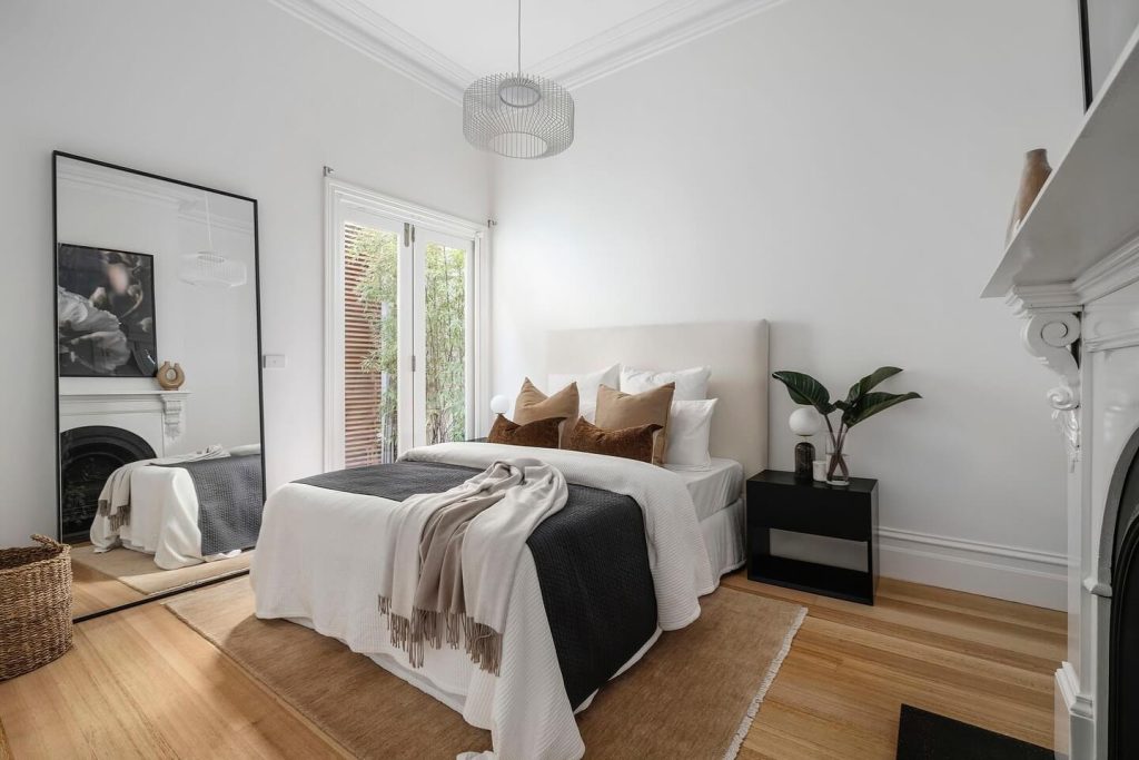 3. Maximize Light with a Minimalist Mirror by the Window