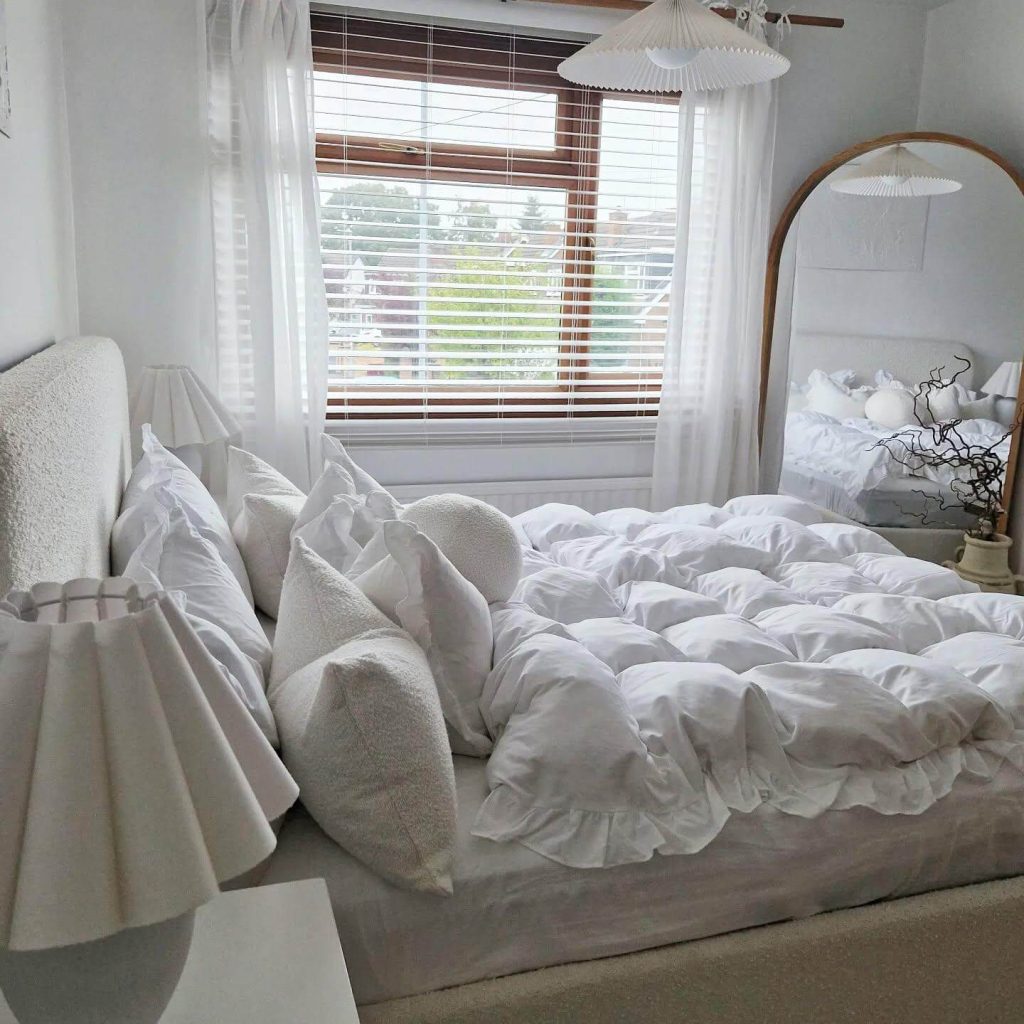 5. Blend Softness and Symmetry with a Window-Aligned Arch Mirror