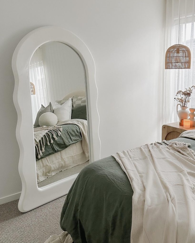 6. Embrace Playful Design with a Wavy Frame Mirror