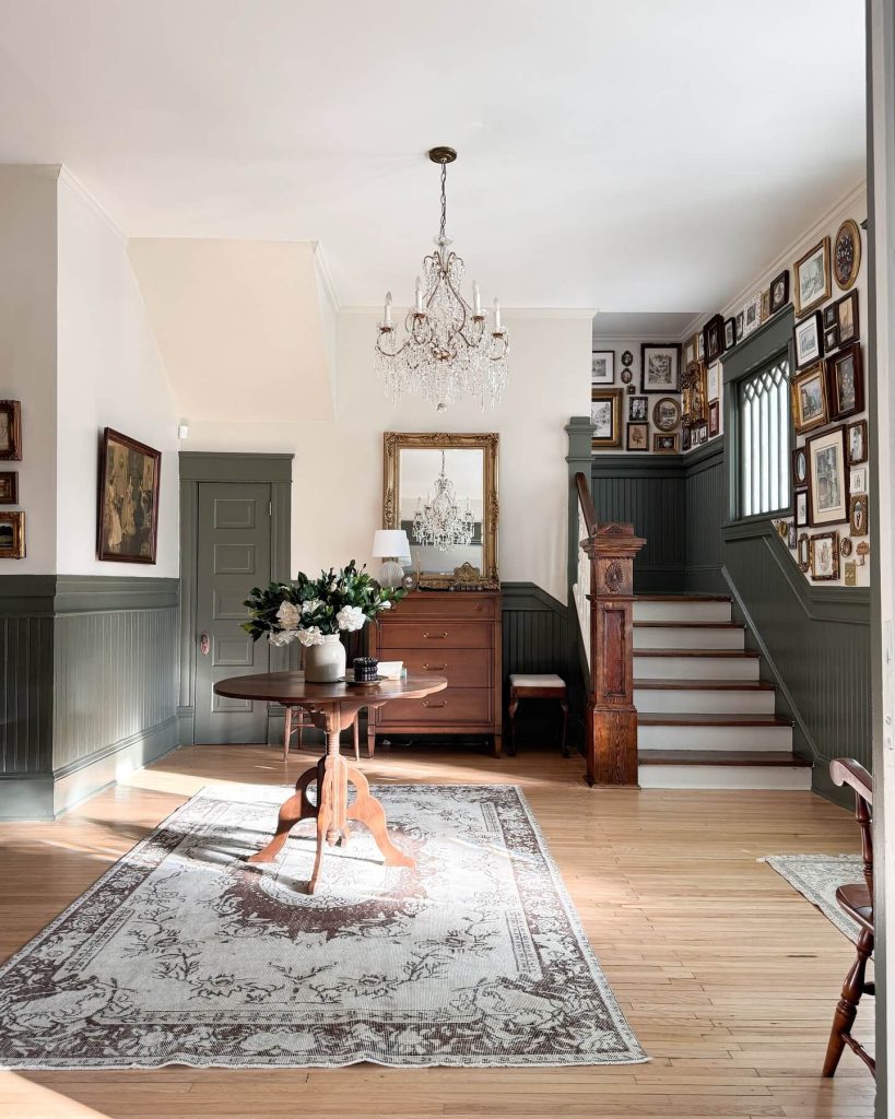 6. Vintage Gallery Wall with Dramatic Wainscoting