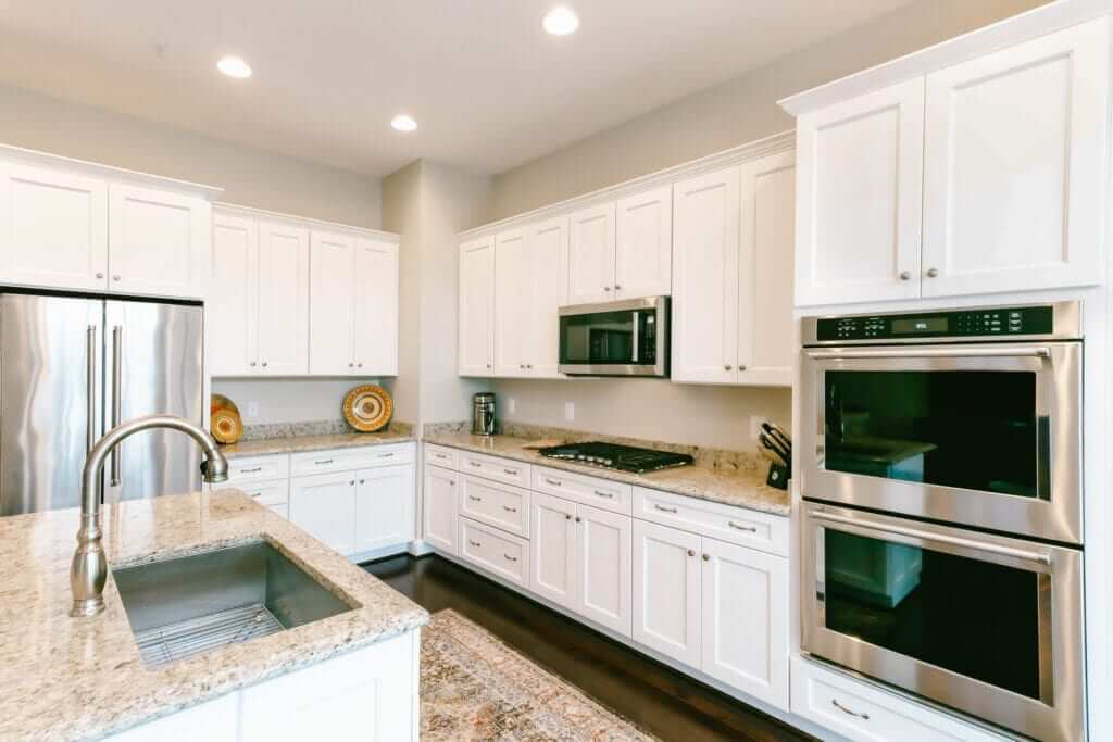 6. Transitional Style with Granite Elegance