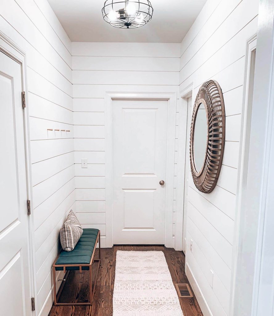 7. Crisp White Elegance in a Narrow Hallway