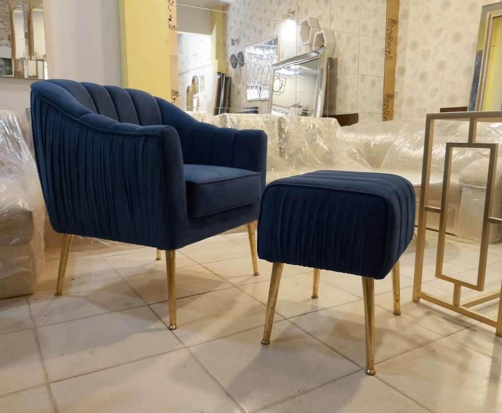 7. Midnight Blue Velvet Chair with Ottoman for Elevated Comfort