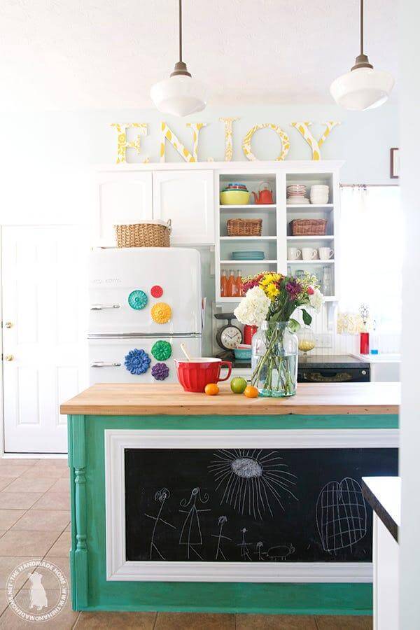 1. Playful and Colorful Above-Cabinet Decor