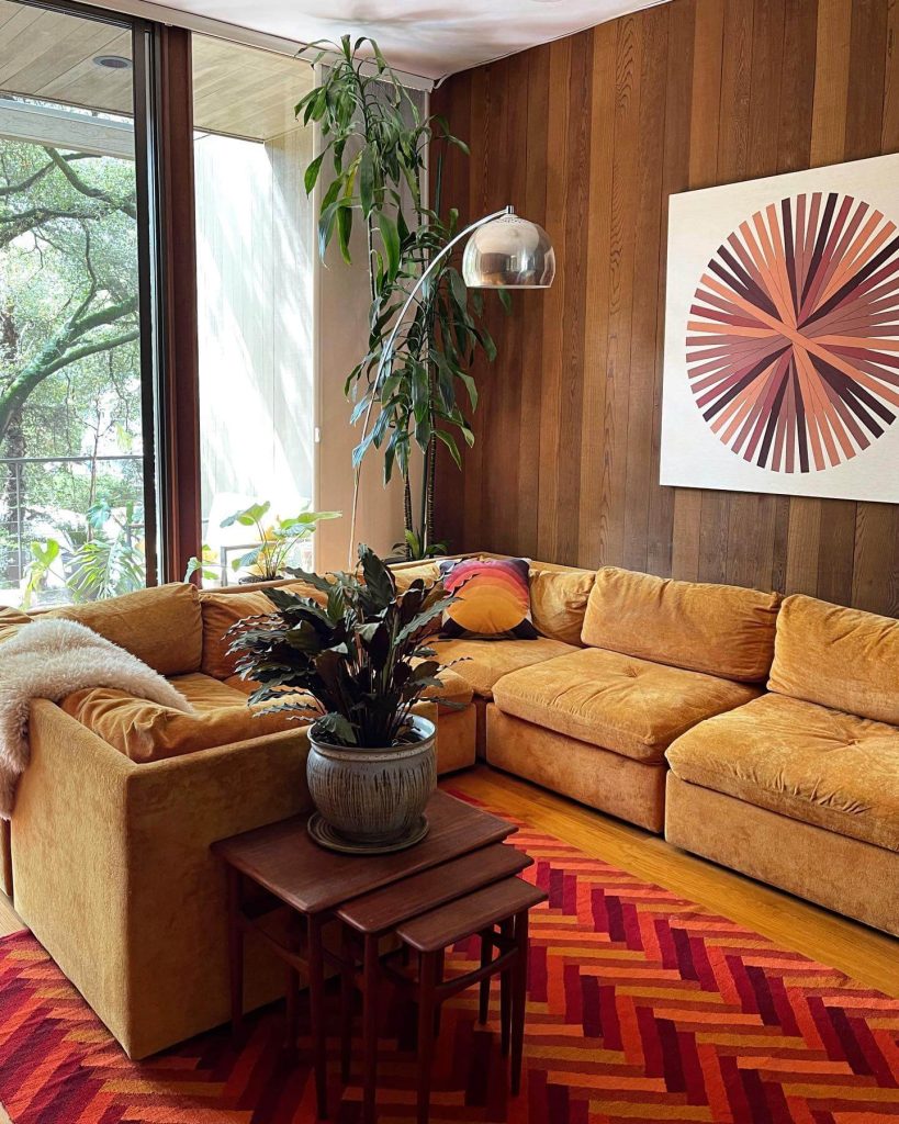 10. Retro Revival with Mustard Velvet and Wood Paneling