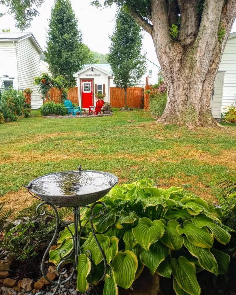 11. Add a Focal Point with a Garden Shed and Sitting Area