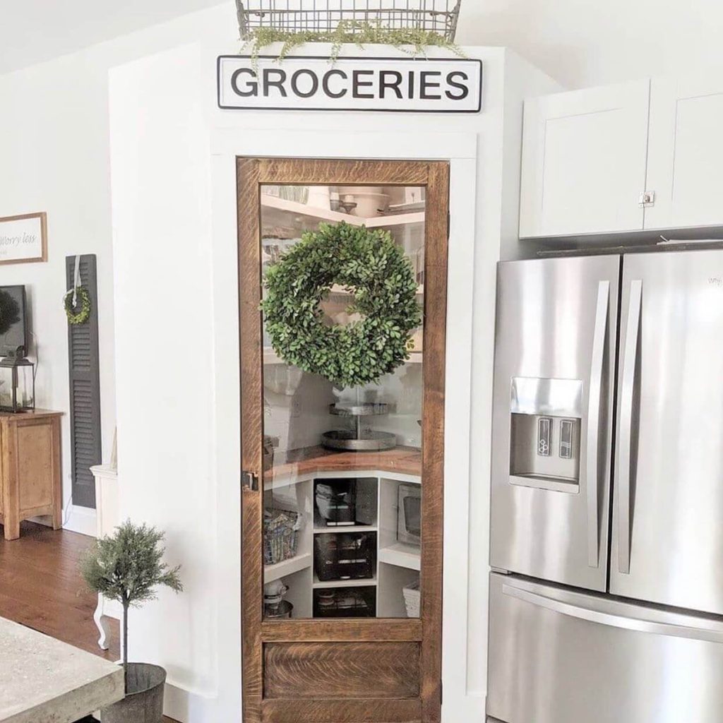 11. Seasonal Simplicity with a Wreath-Adorned Glass Door
