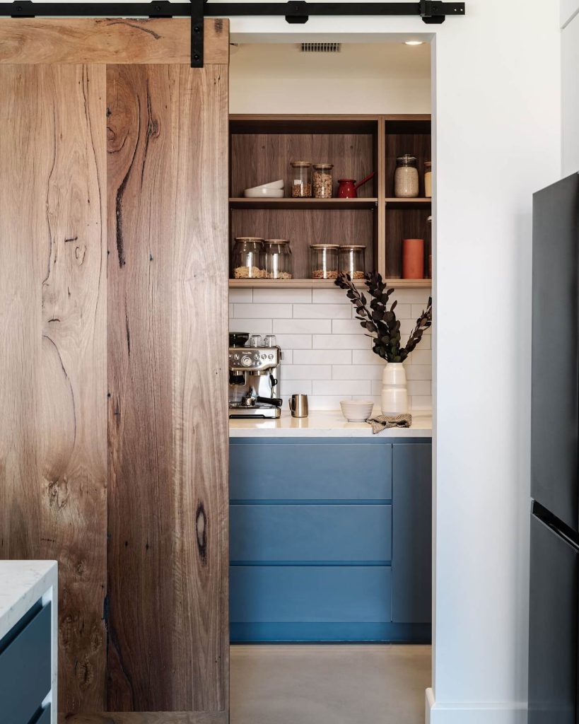 11. Sliding Barn Door Charm Meets Espresso Functionality