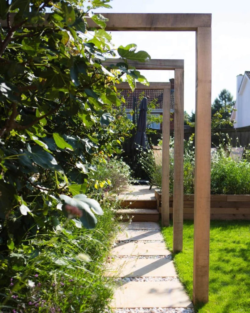 12. Framed Walkway with Vertical Plant Accents