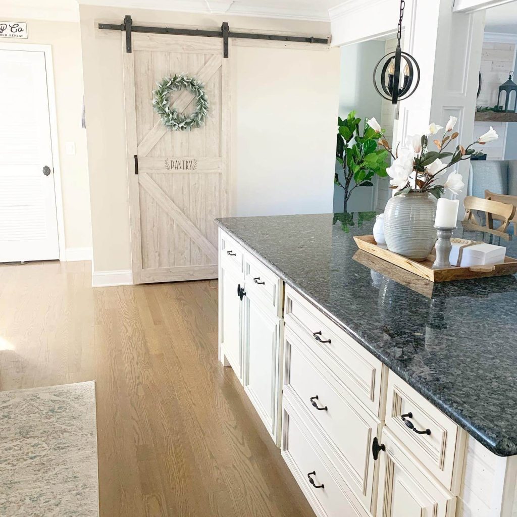 12. Cottage Style with a White Barn Door