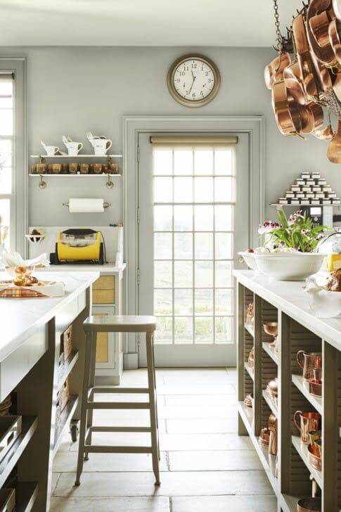 17. Industrial Charm with Copper Pots and Minimalist Shelving