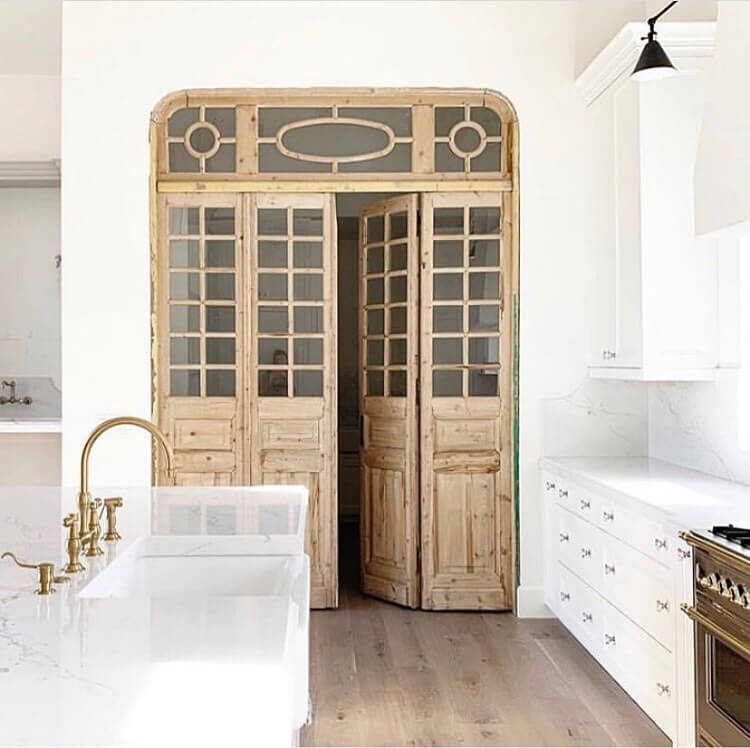 19. Salvaged Elegance with European-Inspired Doors