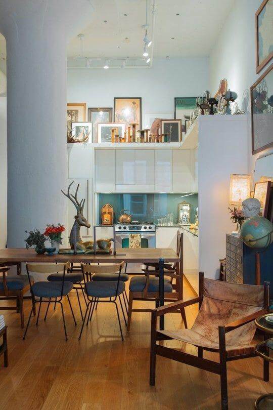 20. Eclectic Boho Vibes with Plants and Unique Collectibles