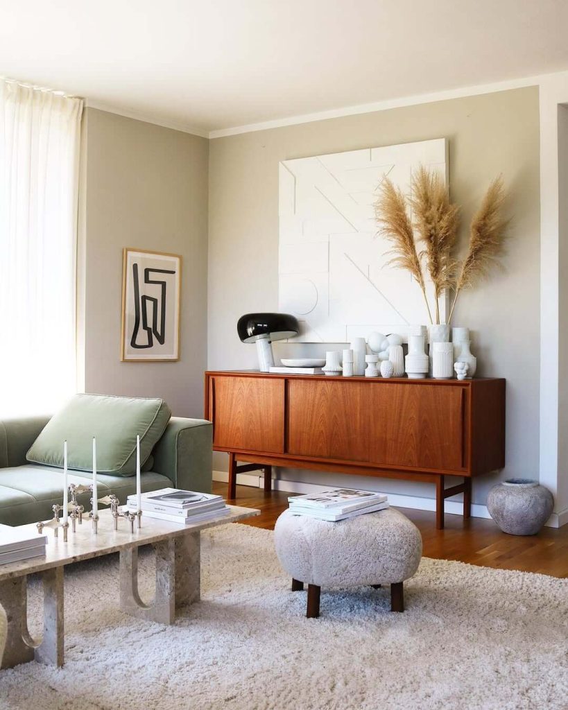 20. Japandi Interior Ideas Green Sofa and Ceramics