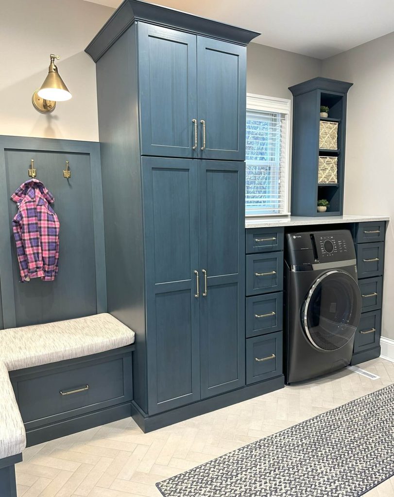 21. Cleverly Concealed Laundry in Mudroom Built-Ins